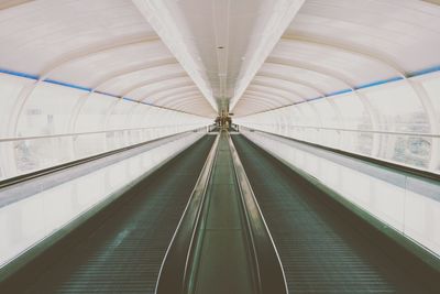 Low angle view of escalator in airport