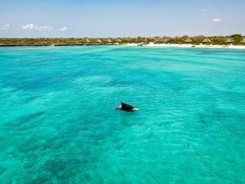 Scenic view of sea against blue sky