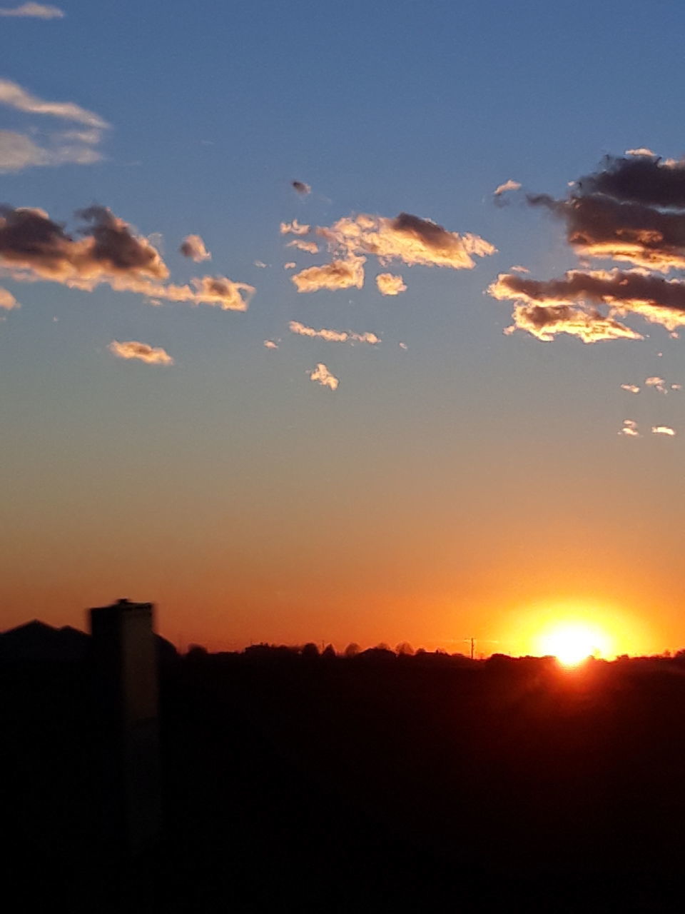 SCENIC VIEW OF SILHOUETTE LANDSCAPE AGAINST ORANGE SKY