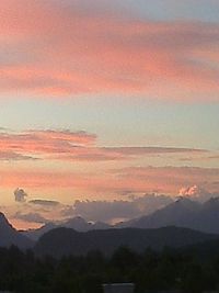 Scenic view of mountains against sky at sunset