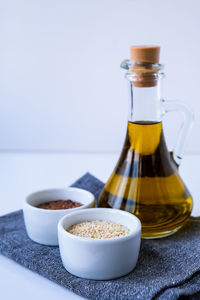 Sesame and flax seeds with oil in glass bottle. healthy food concept. vegan keto diet. healthy