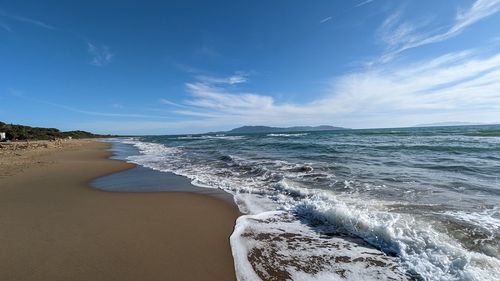 Scenic view of beach against sky