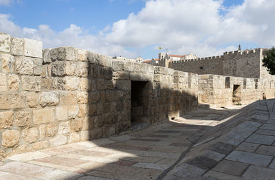 View of historical building against cloudy sky