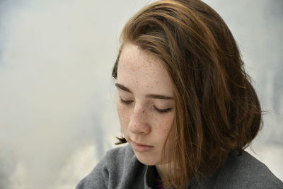 Close-up young woman looking down