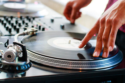 Close-up of dj playing record