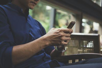 Close up of man using mobile phone.