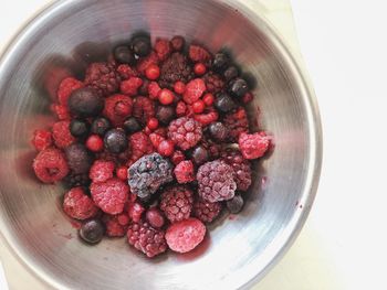 High angle view of strawberries in bowl on table