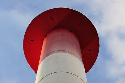 Low angle view of red tower against sky