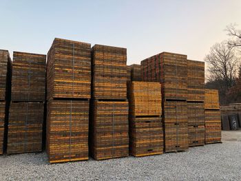 Stack of building in field against clear sky
