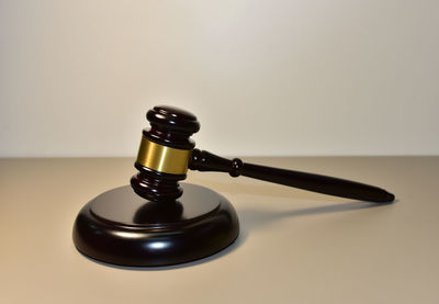 Close-up of lamp on table against white background