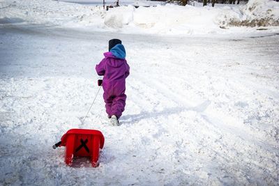 Full length of child in snow