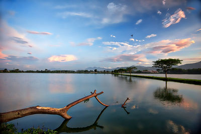 Scenic view of lake against sky during sunset