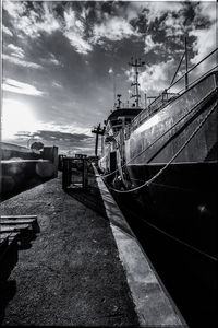 Boats moored at harbor