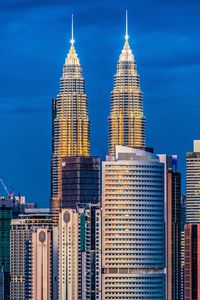 Modern buildings against sky in city