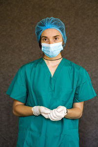 Woman doctors portrait, doctors with mask, glove and uniform. uniform for surgery and viruses.