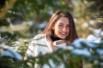 Portrait of a smiling young woman outdoors