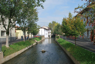View of a canal amidst buildings