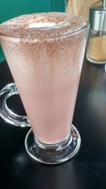 Close-up of coffee cup on table