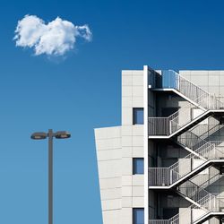 Low angle view of building against blue sky