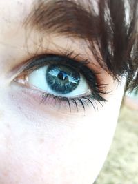 Close-up portrait of woman eye