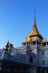 Low angle view of building against blue sky