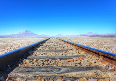 Surface level of railroad track against clear sky