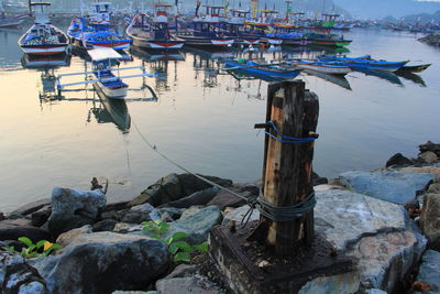 Boats moored in sea