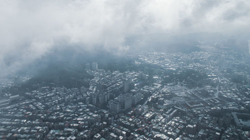 High angle view of buildings in city against sky