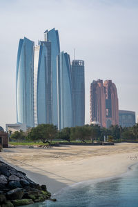 Modern buildings in city against sky