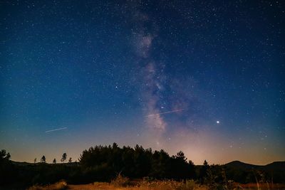 Scenic view of star field against sky at night