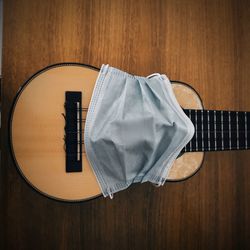 High angle view of guitar on table