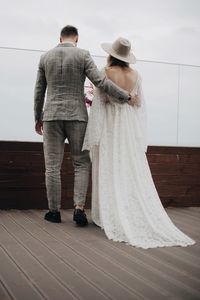 Bride and bridegroom on boardwalk