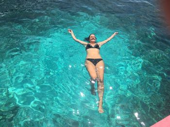 Cheerful woman in swimming pool