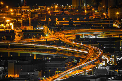 High angle view of light trails on road at night