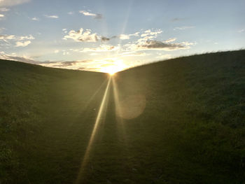 Scenic view of landscape against sky during sunset