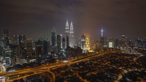 Illuminated buildings in city at night