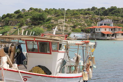 People on boat against trees and plants