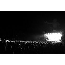 People enjoying music concert at night