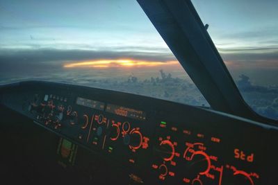 Close-up of airplane against sky in city