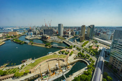 High angle view of city buildings against clear sky