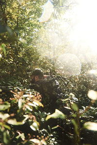 Young man and leaves on tree