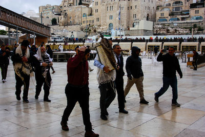 People standing on street in city