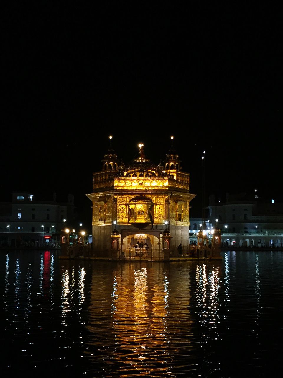 REFLECTION OF ILLUMINATED BUILDINGS IN WATER