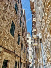 Low angle view of old buildings in town