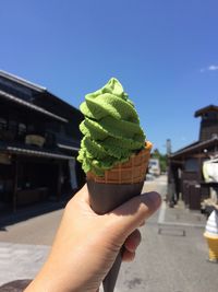 Midsection of person holding ice cream