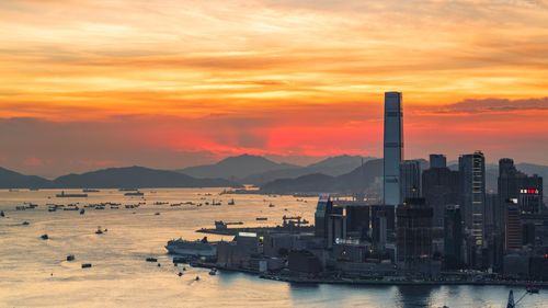 View of boats in sea at sunset