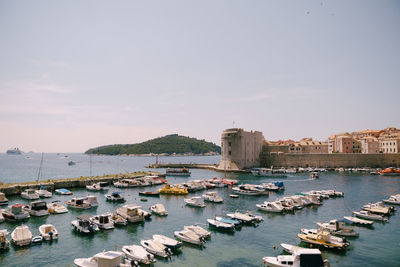 Boats moored at harbor