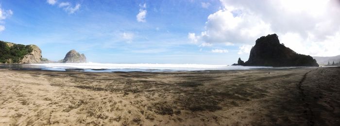 Scenic view of sea against cloudy sky