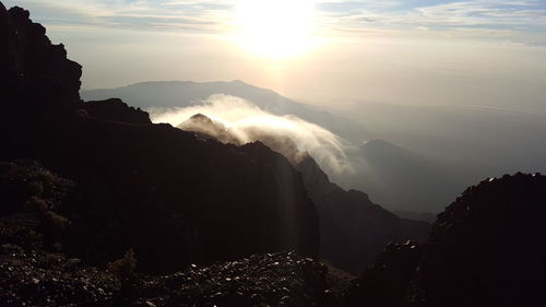 Scenic view of mountains against sky during sunset