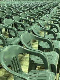 High angle view of empty chairs at swimming pool